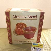 Front view of the original box for the Tumbleweed Pottery Monkey Bread Baking Mold showing product image and branding.