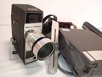 Bell & Howell camera with attached adjustable metal flash mount bracket and lens close-up