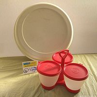 Photo shows large beige Tupperware 6-compartment server with a removable dip container lid underneath the platter.