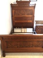 Full view of assembled headboard, footboard and rails showing overall frame design