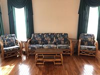 Front view of full set: sofa, two chairs, end tables and coffee table