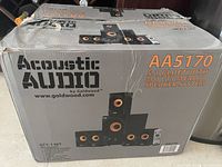 Box of Acoustic Audio AA5170 5.1 Bluetooth multimedia speaker system showing branding, model number, and image of speakers including subwoofer and satellite speakers.