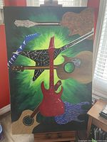 Framed oil on canvas painting featuring six stylized guitars on green and black background, size approximately 84 x 48 inches.