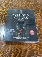 Box of The Whisky Cubes Pack with branded cover showing whisky glass with whisky cubes and details of contents.