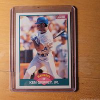 Front of the 1989 Score Ken Griffey Jr. rookie card 100T, showing the player batting in Mariners uniform
