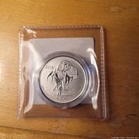 Front-facing image of the 2016 $20 silver coin displaying a detailed Tyrannosaurus Rex skeleton head design with the year 2016.