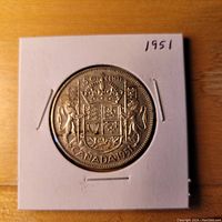 Front side showing the Canadian Coat of Arms with '50 CENTS CANADA 1951' text.