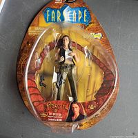 Full packaging front view showing the Aeryn Sun mutation figure and the Farscape logo.