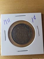 Reverse side of the 1911 Canadian Large Cent showing 'ONE CENT CANADA 1911' with floral designs.