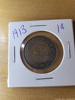 Reverse side of the 1913 Canadian Large One Cent showing denomination and year surrounded by ornate wreath.