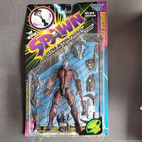 Full packaged McFarlane Spawn Battleclad ultra-action figure showing figure and accessories inside plastic blister on illustrated card.