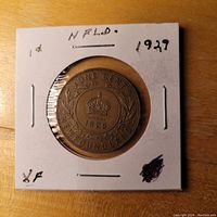 Reverse side of Newfoundland One Cent Coin showing crown, date 1929 and wreath inside 2x2 cardboard holder