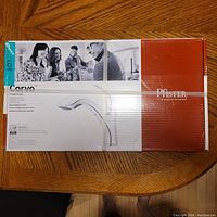 Box of Pfister Corvo Polished Chrome Pull-Out Kitchen Faucet with branding and product image