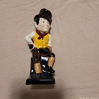 Front view of the Royal Doulton Sam Weller caricature figurine showing detailed paint and seated posture.