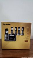 Front view of the boxed Panasonic KX-TG175C phone system showing the base unit and 4 handsets on packaging.