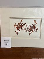 Full view of the Bill Reid print featuring two stylized coppery frogs in indigenous art style, visible signature on bottom right.