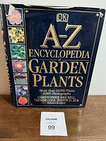 Front cover of the hardcover encyclopedia showing title, authors, and plant photographs.