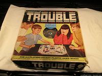 Original box for 1965 Trouble game showing vintage graphics and text.