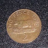 Close-up of the reverse side of the 1988 2 Pence coin showing the cow and calf design, the denomination '2', and the text 'TWO PENCE 1988'.