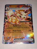 Front view of the Arcanine EX full art holo Pokemon card showing artwork and text details.