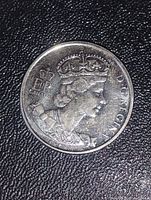 Obverse side of the coin showing Queen Elizabeth II crowned portrait with inscriptions.