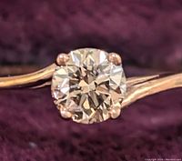 Close-up of the round brown diamond set in a 10K gold ring, showing prong setting and diamond facets.