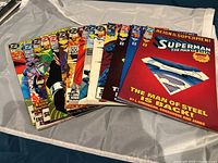 Lot of Reign of Superman comic books issues 13 to 30 with some missing. Comics laid out fanned, showing front covers with colorful artwork.