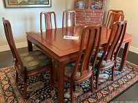 Overall view of table set with chairs in room