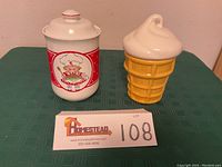 Both cookie jars on table showing entire items