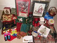 Photo showing the entire assortment of Christmas decorations including framed prints, stockings, table linens, baskets, ornaments, boxes, and more