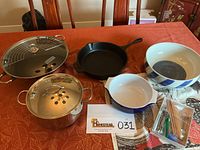 Full set on a table, showing cookware items and serving utensils