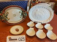 Full set of holiday-themed serving platters, decorative plate, and bowls arranged for display