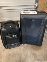 Photo showing both the Samsonite hard shell suitcase and the Travis Mathew soft carry-on bag side by side on the floor.