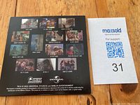 Back view of the cardboard promotional case showing multiple movie stills and Universal and Amblin Entertainment logos