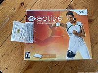 Photo of the front of Wii Active game box showing the brand, title, and box condition.
