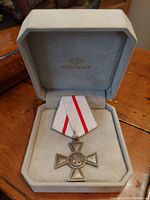 Silver St. George Cross 3rd Class medal with white and red ribbon inside a grey presentation box.