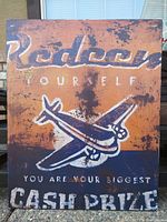 Front view of vintage wooden artwork showing airplane and motivational text with distressed paint and wood texture.