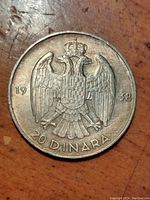 Obverse and reverse views of a 1938 Yugoslavia 20 Dinara silver coin showing crowned double-headed eagle, date and denomination.