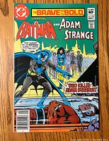 Front cover of The Brave and the Bold #190 featuring Batman and Adam Strange with comic text and graphics.