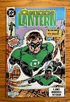 Front cover of Green Lantern #1 comic book showing characters in green suits flying with logo and text.