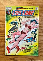 Front cover of the Lois Lane comic book issue #111 depicting Lois Lane trapped while Justice League members appear on the scene, dated July, priced 15 cents.