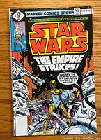Front cover of the Star Wars comic book issue #18 by Marvel Comics Group showing characters and title The Empire Strikes!