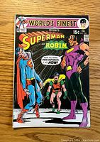 Front cover of World's Finest #200 featuring Superman in blue and red suit, Robin in green and red, and a large purple villain with a yellow chest, set on a dramatic background.
