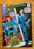 Front cover photo of Superman #209 vintage comic book showing Superman and Clark Kent artwork and text bubbles.
