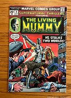 Front cover showing the Living Mummy and multiple armed men in an action scene with the title Supernatural Thrillers #8 and price 25 cents.