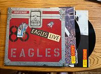 Front cover and two vinyl records partially pulled out for display