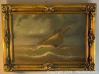 Full view of antique oil painting depicting a ship in stormy seas, with an ornate decorative gold frame showing cracks.