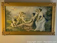 Full view of the vintage Victorian-style picture frame with decorative gold-colored corners and artwork featuring women and cherubs.