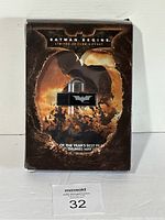 Photo of the Batman Begins Limited Edition Giftset box showing cover art and bat-shaped item inside clear plastic, front view.