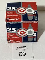Photo showing front of two stacked boxes of Crosman CO2 cartridges, each box labeled with quantity and brand.
